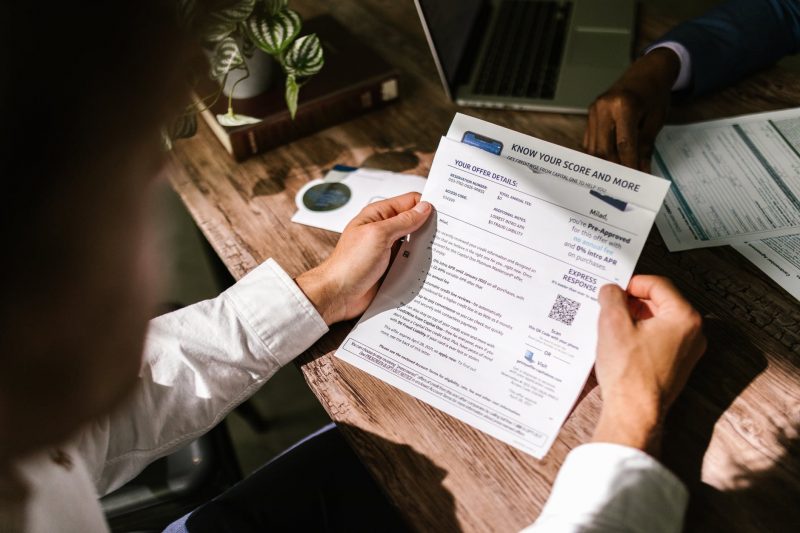 person viewing credit score document