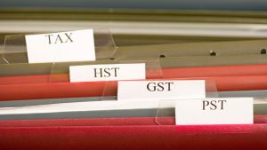 A filing cabinet to help a small business owner stay on top of their HST/GST filing – Merchant Growth