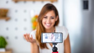 Small business owner recording a video for social media marketing