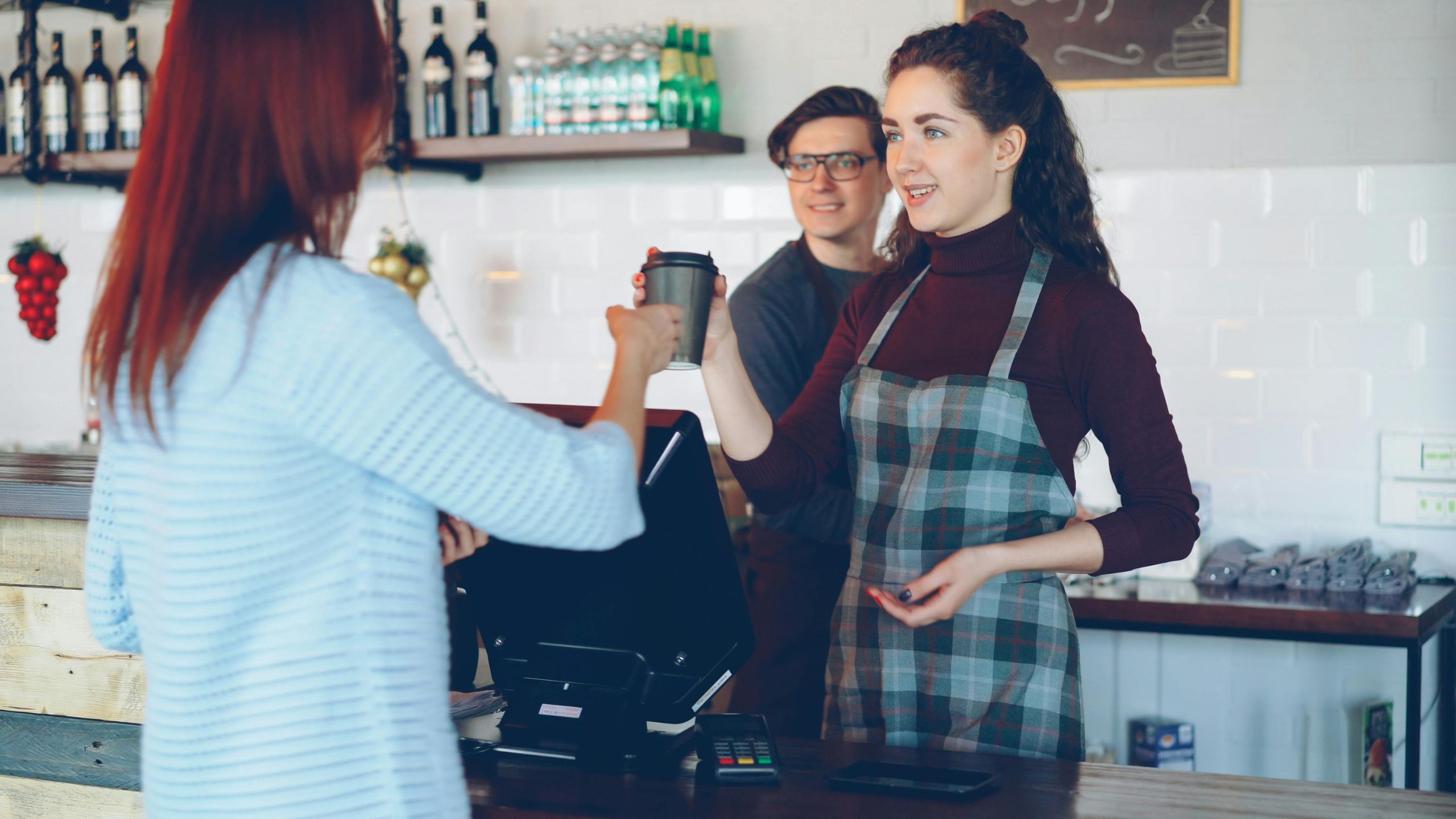 A small business owner being happy to work with loyal customers